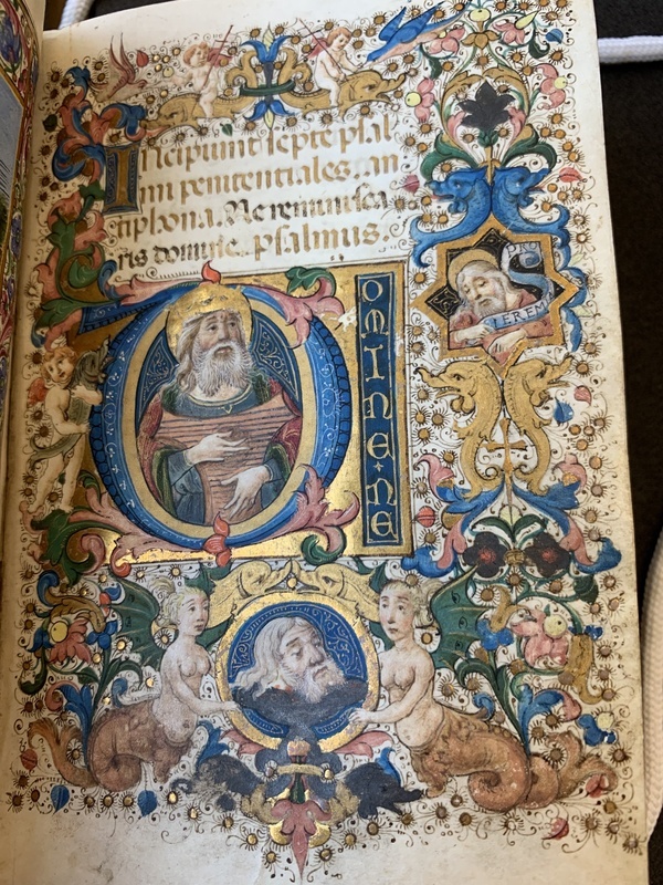 Full page illustration of King David playing the lyre with the head of Goliath sitting below